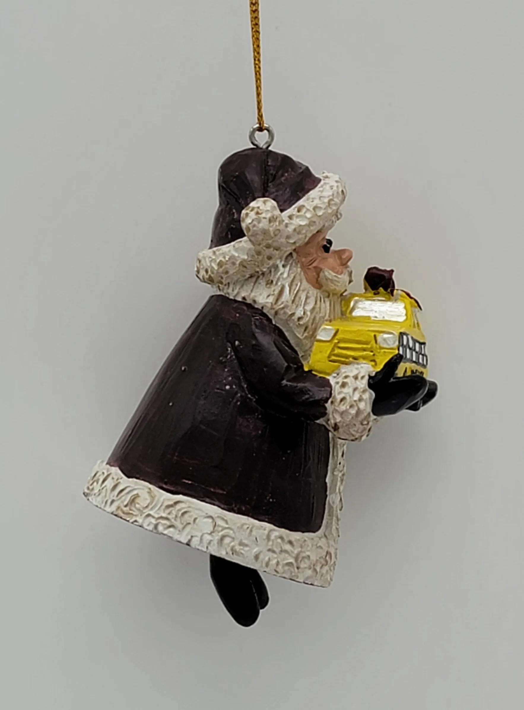 Santa holding a Yellow Cap NYC Taxi Christmas ornament